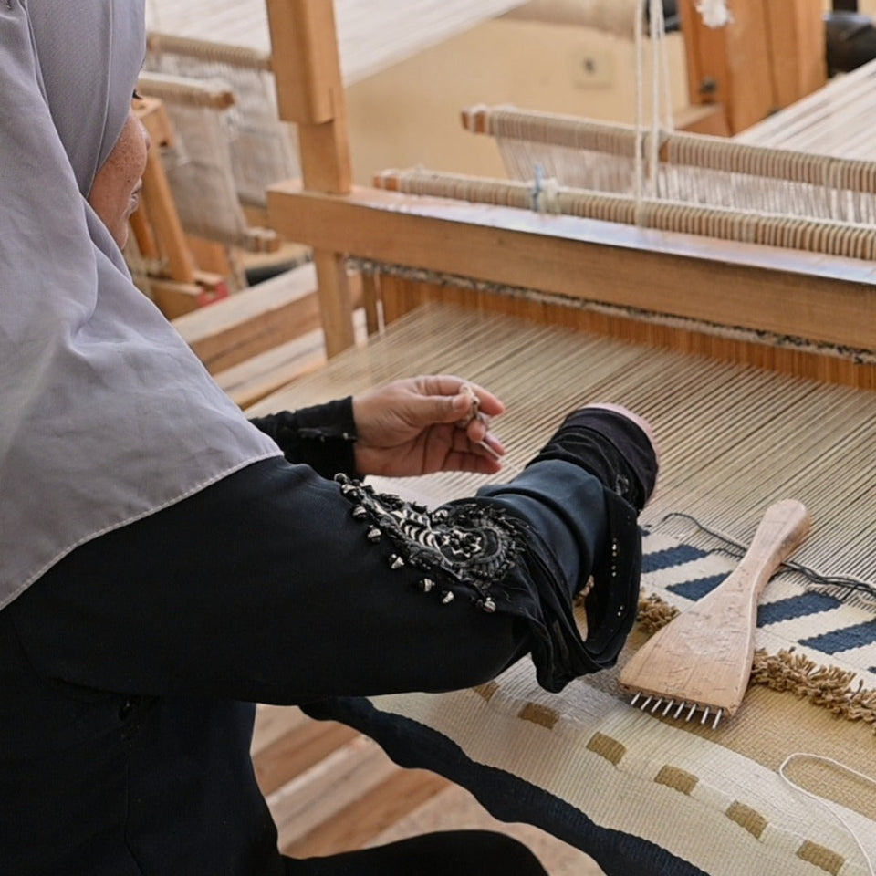 Flat-woven Egyptian kilim made of natural wool with earthy geometric patterns.