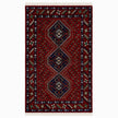 rug in deep red wool with triple diamond motif, demonstrating handwoven rug craftsmanship.