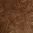 rug in brown wool with Islamic star geometry motif, demonstrating handwoven rug craftsmanship.