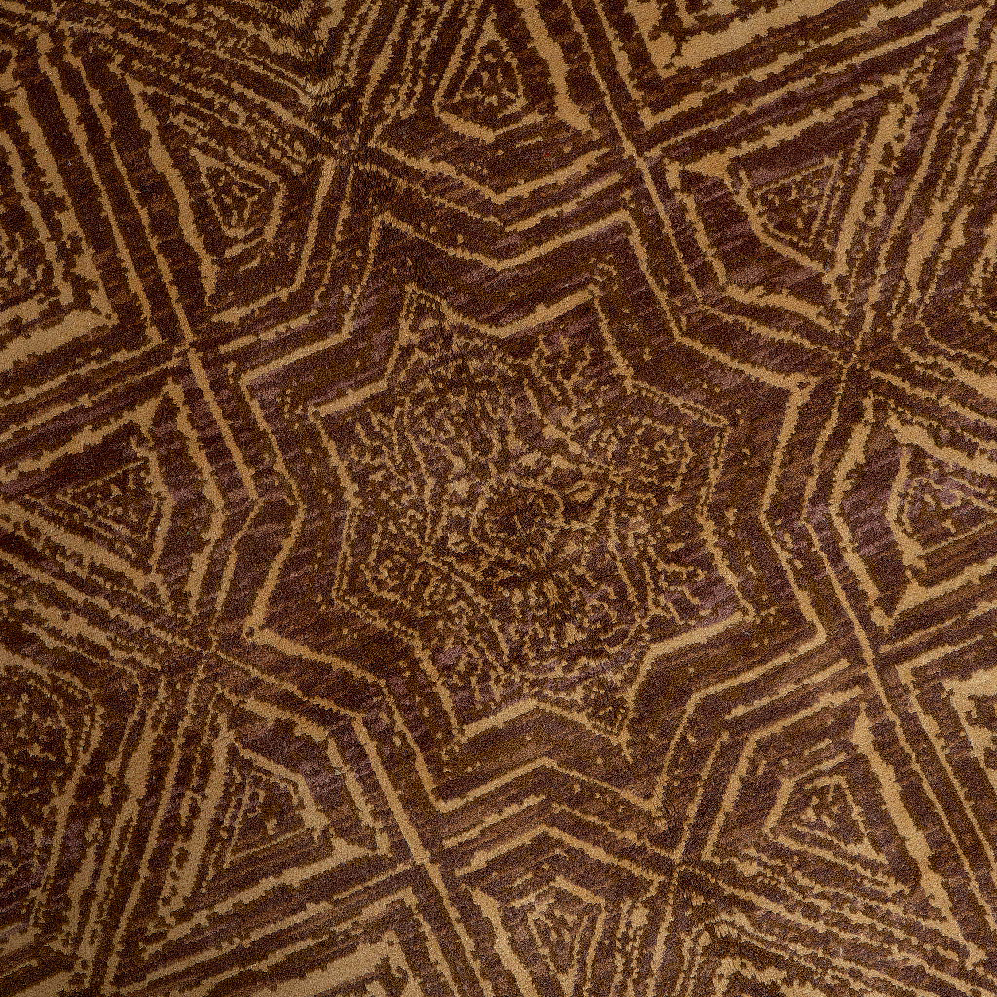 rug in brown wool with Islamic star geometry motif, demonstrating handwoven rug craftsmanship.