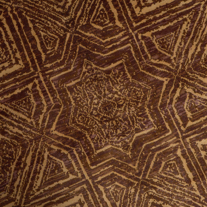 rug in brown wool with Islamic star geometry motif, demonstrating handwoven rug craftsmanship.