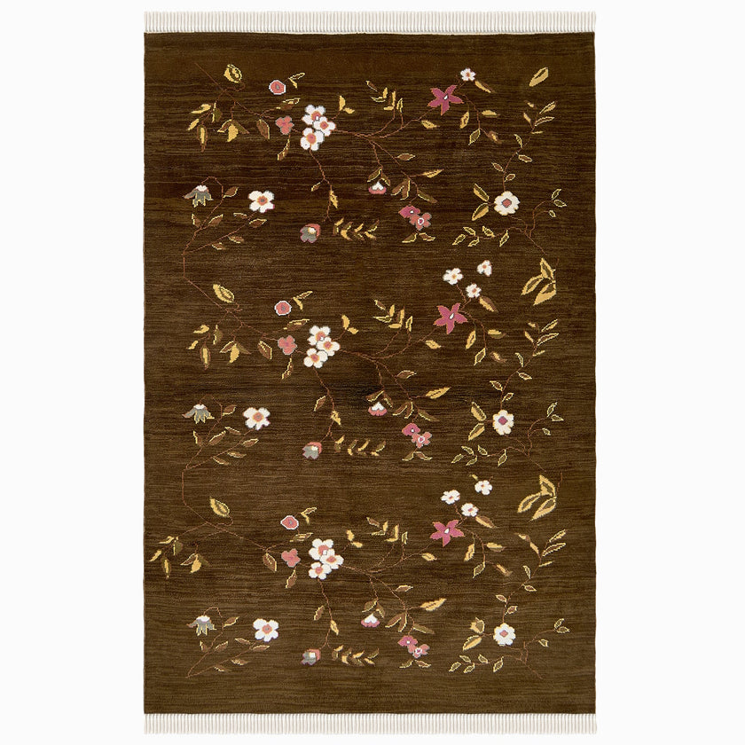 rug in brown wool with vinework floral motif, demonstrating handwoven rug craftsmanship.