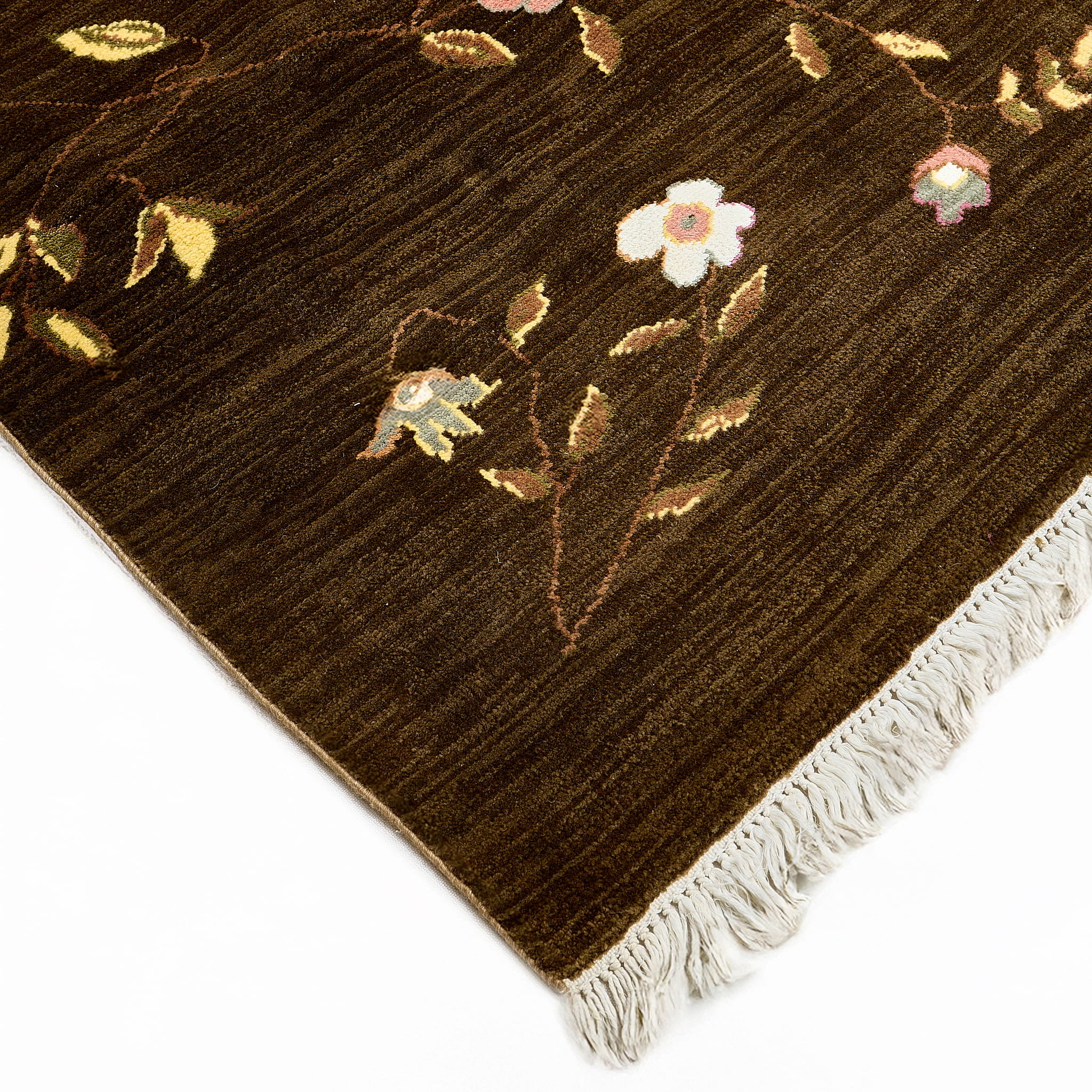 rug in brown wool with vinework floral motif, demonstrating handwoven rug craftsmanship.