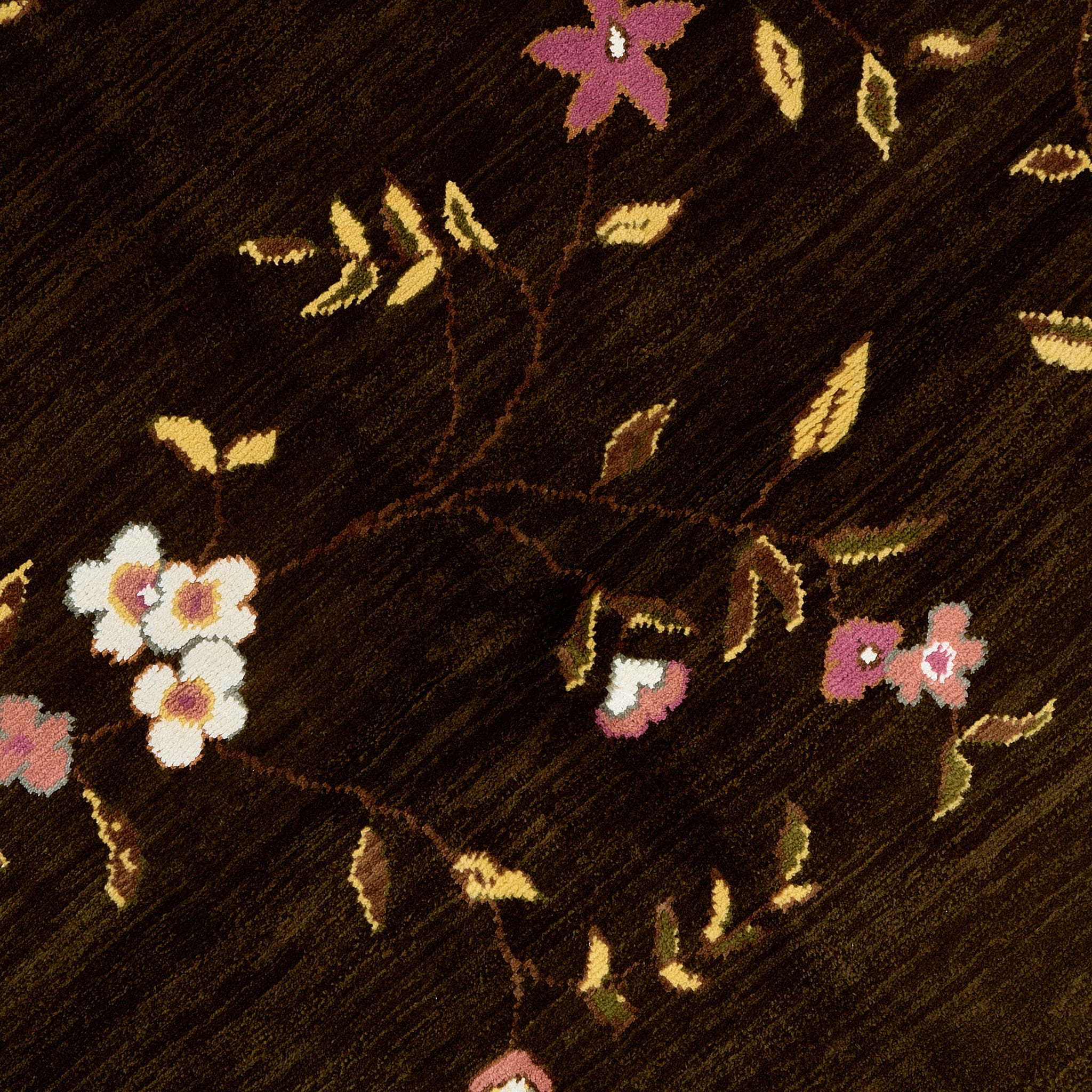 rug in brown wool with vinework floral motif, demonstrating handwoven rug craftsmanship.