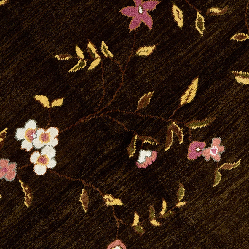 rug in brown wool with vinework floral motif, demonstrating handwoven rug craftsmanship.