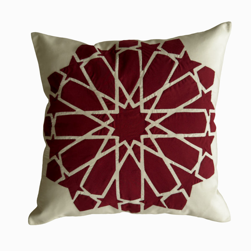 Cushion in burgundy polycotton with Najmi star geometry, demonstrating Khayamiya craftsmanship.