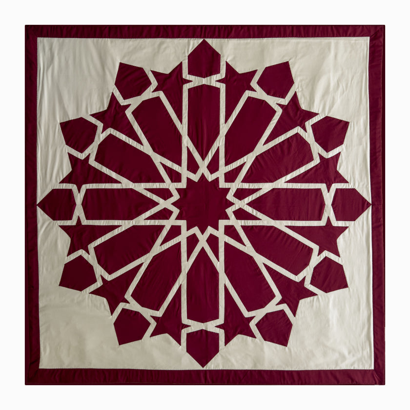 Square runner in burgundy polycotton with Najmi star geometry, demonstrating Khayamiya craftsmanship.