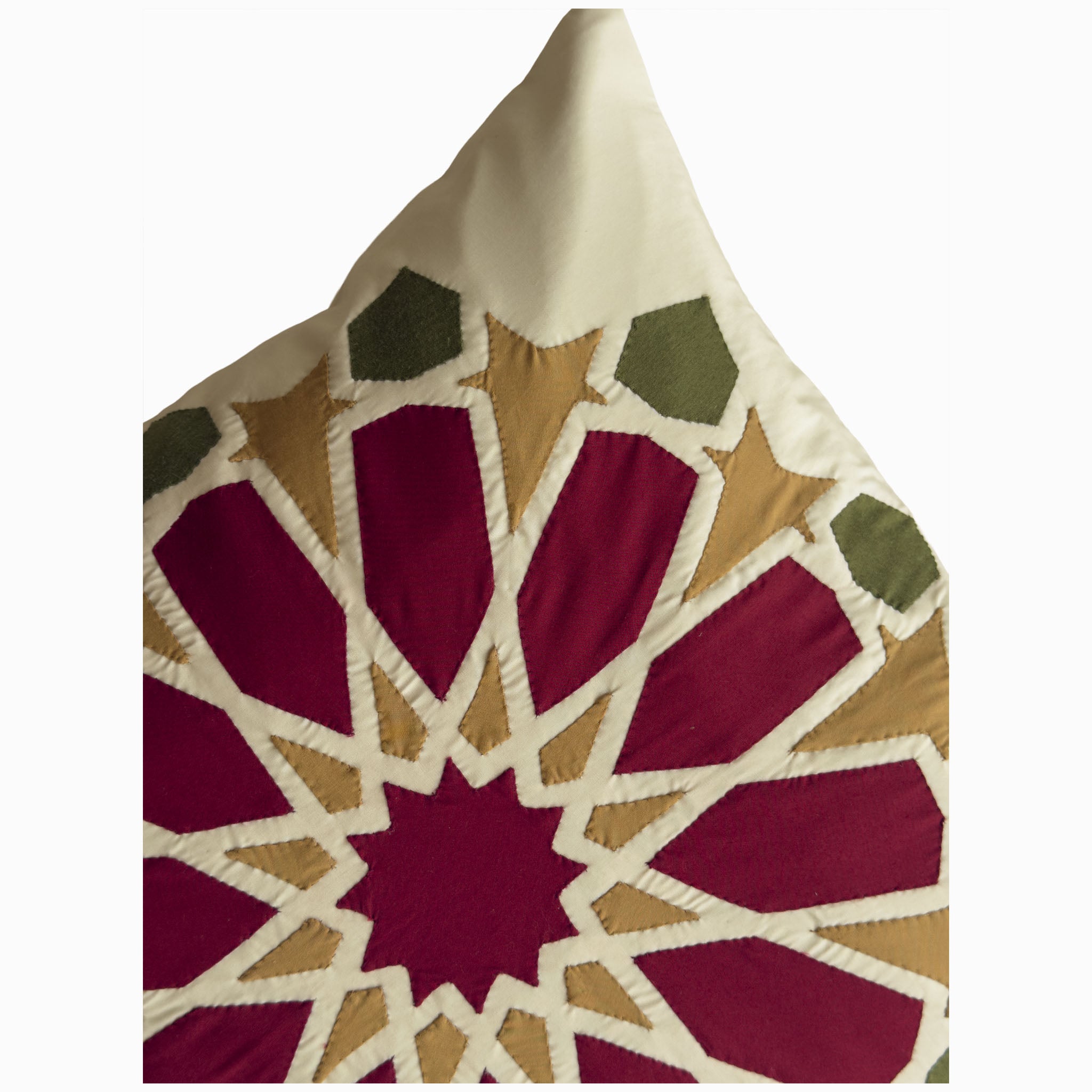 Cushion in burgundy and olive polycotton with Najmi star geometry, demonstrating Khayamiya craftsmanship.