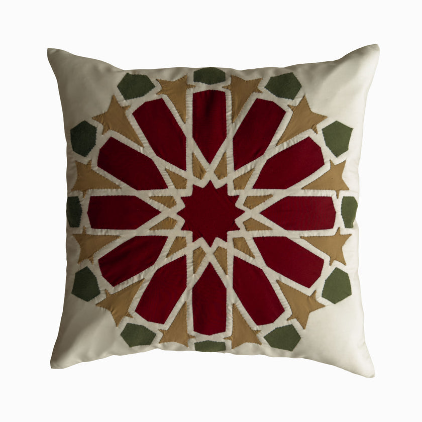 Cushion in burgundy and olive polycotton with Najmi star geometry, demonstrating Khayamiya craftsmanship.