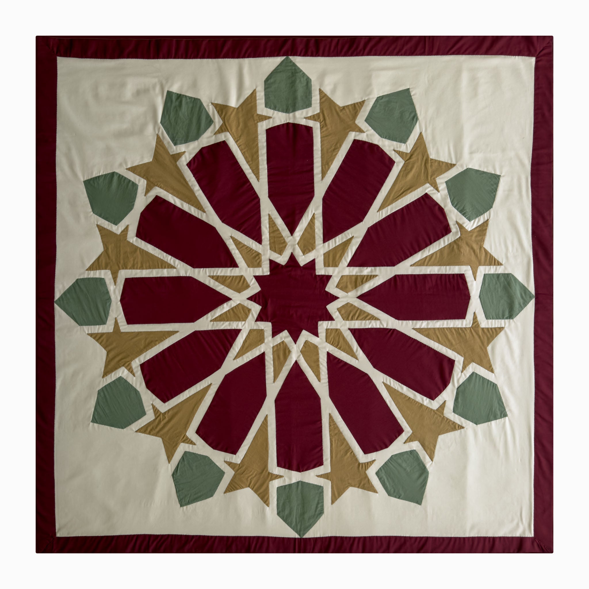 Square runner in burgundy and olive polycotton with Najmi star geometry, demonstrating Khayamiya craftsmanship.