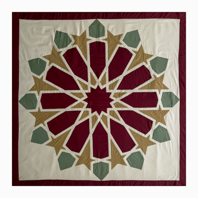 Square runner in burgundy and olive polycotton with Najmi star geometry, demonstrating Khayamiya craftsmanship.