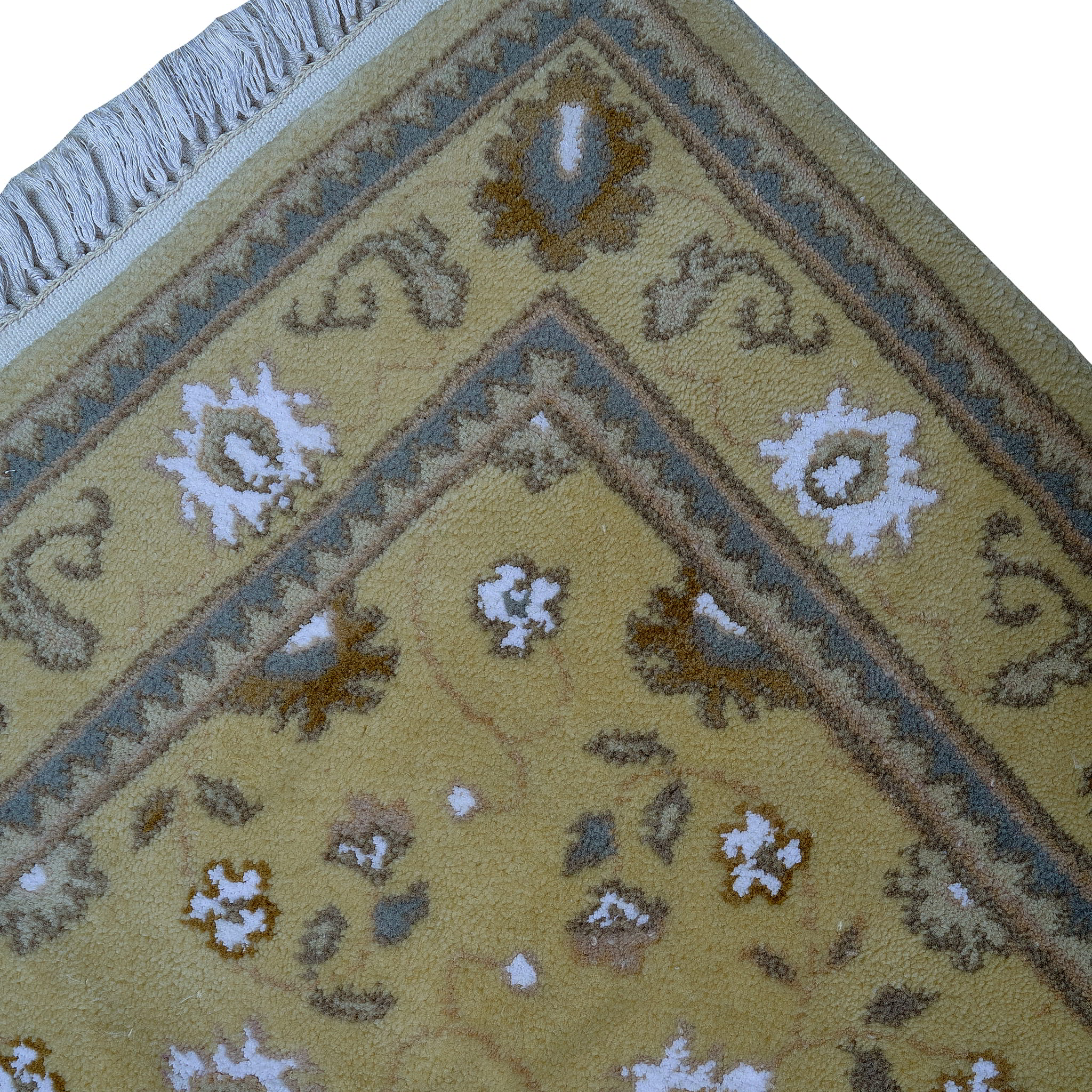 rug in camel wool–silk blend with floral field motif, demonstrating handwoven rug craftsmanship.