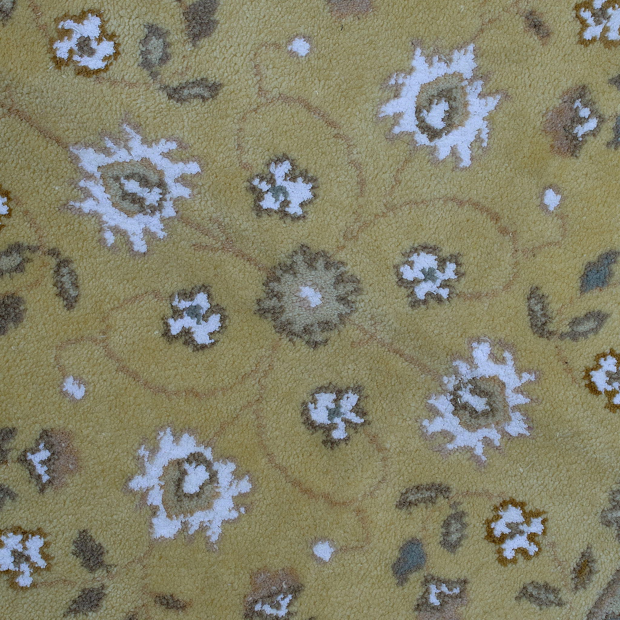 rug in camel wool–silk blend with floral field motif, demonstrating handwoven rug craftsmanship.