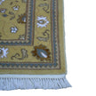 rug in camel wool–silk blend with floral field motif, demonstrating handwoven rug craftsmanship.