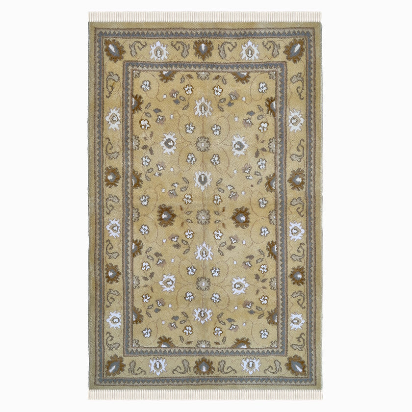 rug in camel wool–silk blend with floral field motif, demonstrating handwoven rug craftsmanship.