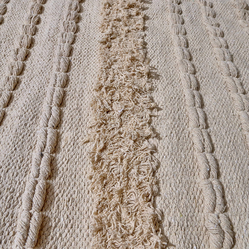 kilim in cream cotton with textured stripe motif, demonstrating kilim craftsmanship.