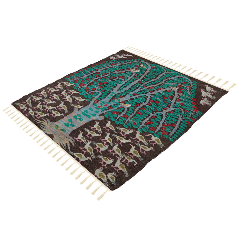 rug in deep red wool with floral medallion motif, demonstrating handwoven rug craftsmanship.
