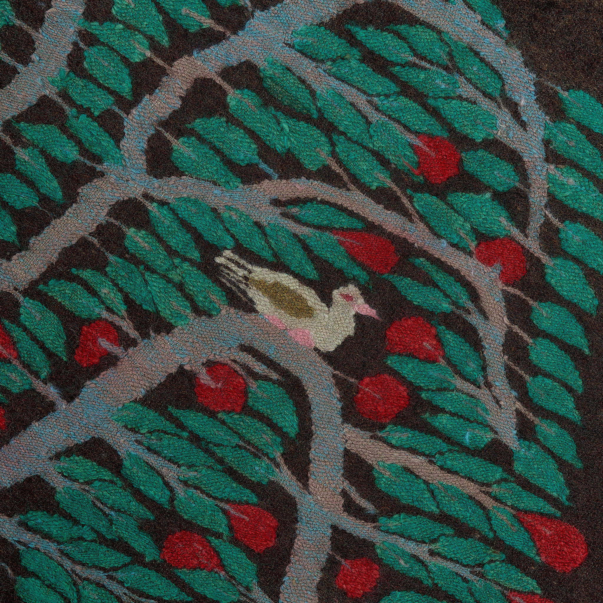 rug in deep red wool with floral medallion motif, demonstrating handwoven rug craftsmanship.