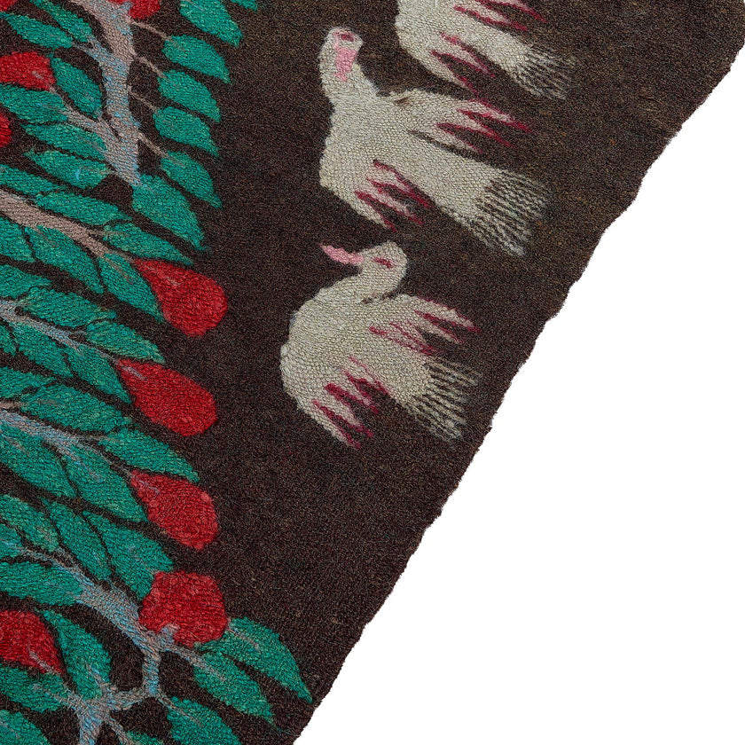 rug in deep red wool with floral medallion motif, demonstrating handwoven rug craftsmanship.
