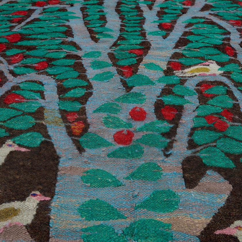 rug in deep red wool with floral medallion motif, demonstrating handwoven rug craftsmanship.