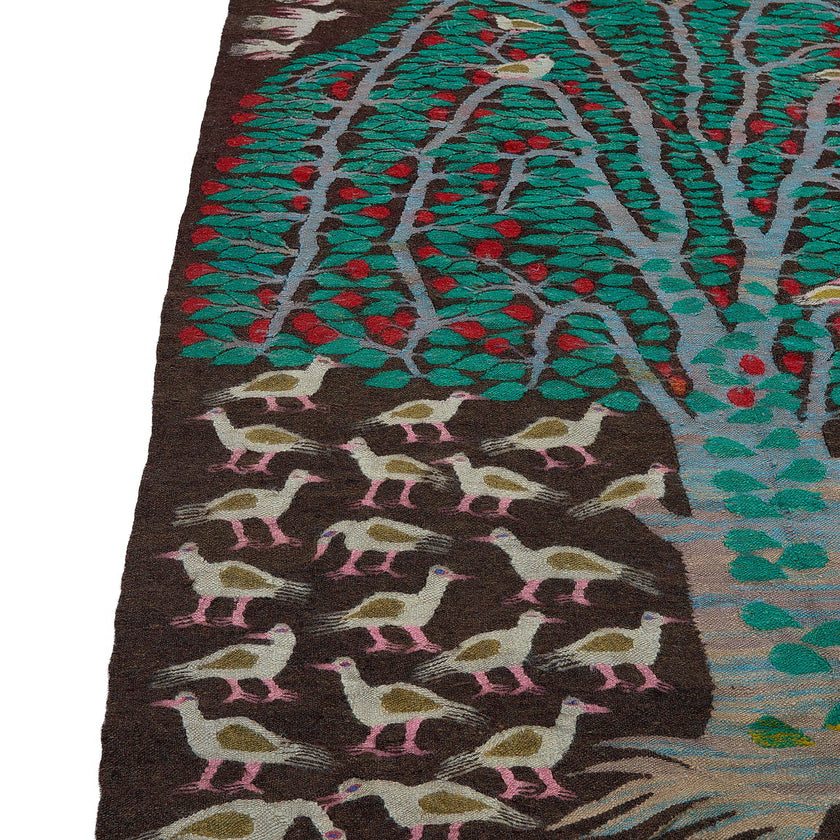 rug in deep red wool with floral medallion motif, demonstrating handwoven rug craftsmanship.