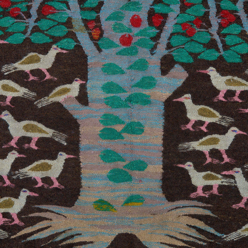 rug in deep red wool with floral medallion motif, demonstrating handwoven rug craftsmanship.