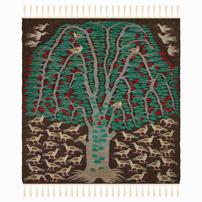 rug in deep red wool with floral medallion motif, demonstrating handwoven rug craftsmanship.