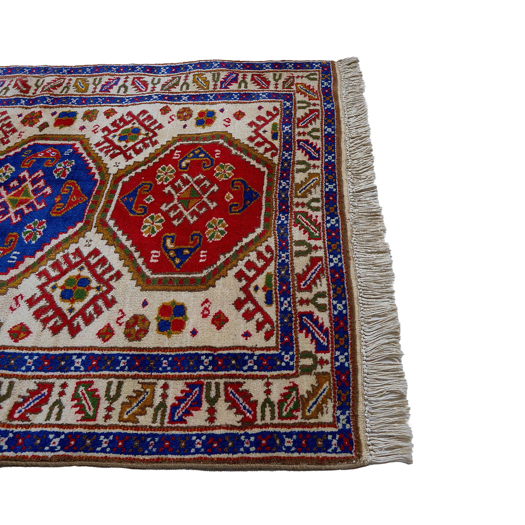rug in deep red wool with triple medallion motif, demonstrating handwoven rug craftsmanship.