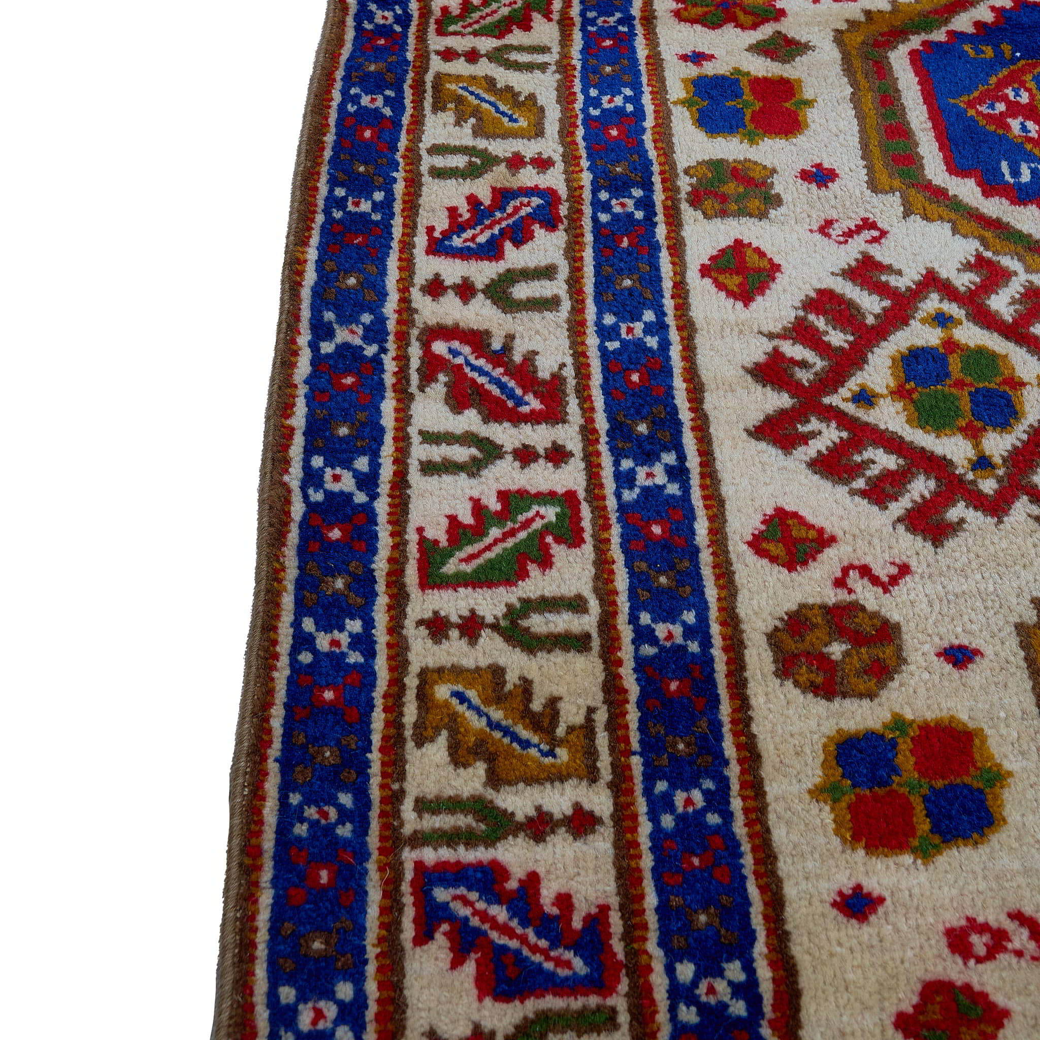 rug in deep red wool with triple medallion motif, demonstrating handwoven rug craftsmanship.