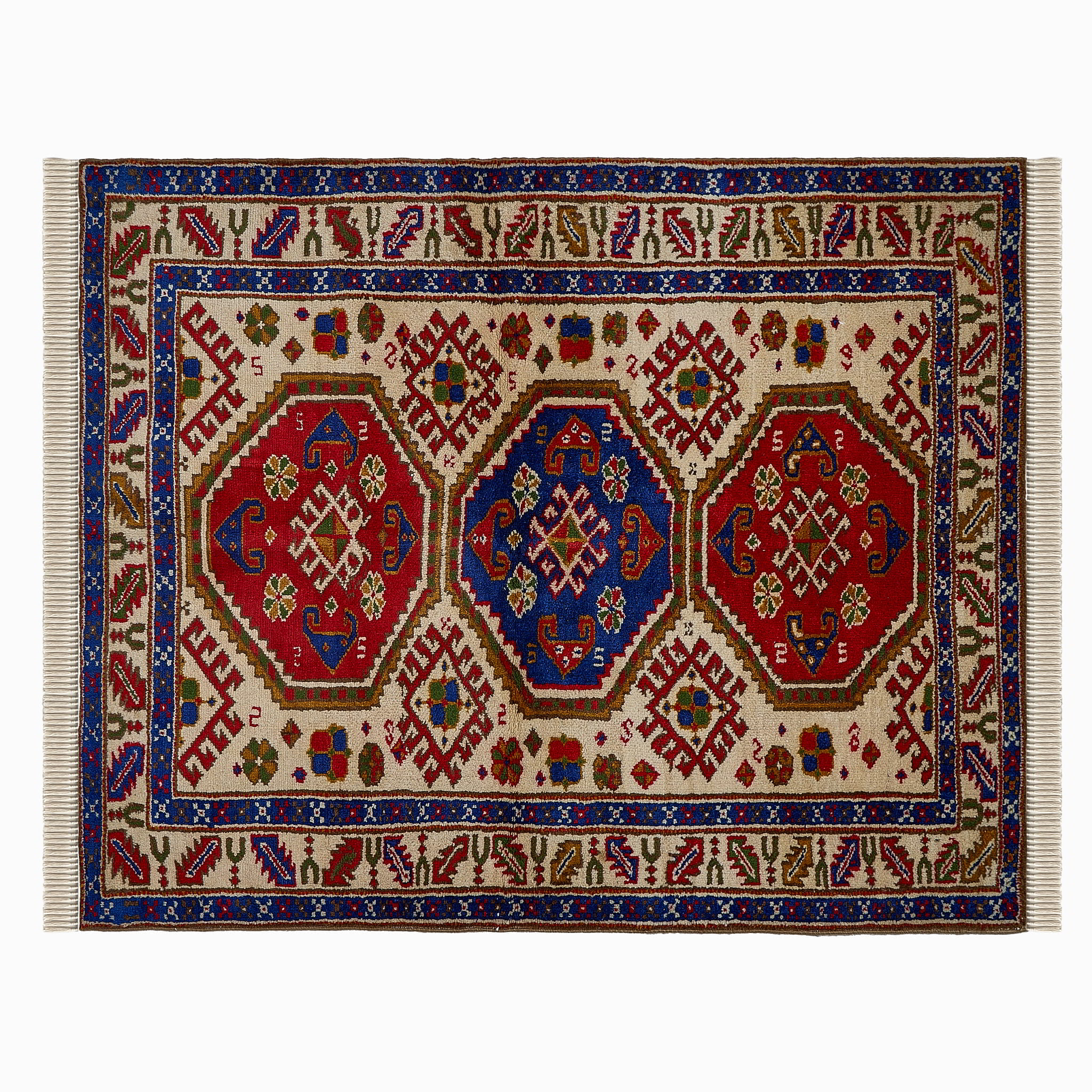 rug in deep red wool with triple medallion motif, demonstrating handwoven rug craftsmanship.