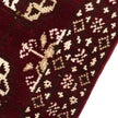 rug in deep red wool with rosette field motif, demonstrating kilim craftsmanship.
