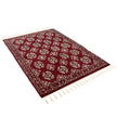 rug in deep red wool with rosette field motif, demonstrating kilim craftsmanship.