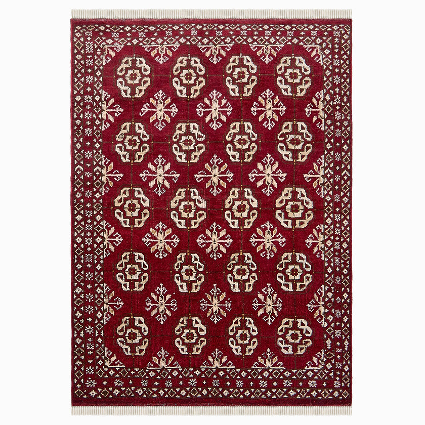 rug in deep red wool with rosette field motif, demonstrating handwoven rug craftsmanship.