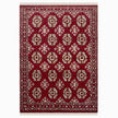 rug in deep red wool with rosette field motif, demonstrating kilim craftsmanship.