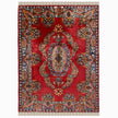rug in deep red silk with oval floral medallion motif, demonstrating handwoven rug craftsmanship.