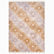 rug in lavender wool with floral/tile quatrefoil motif, demonstrating handwoven rug craftsmanship.
