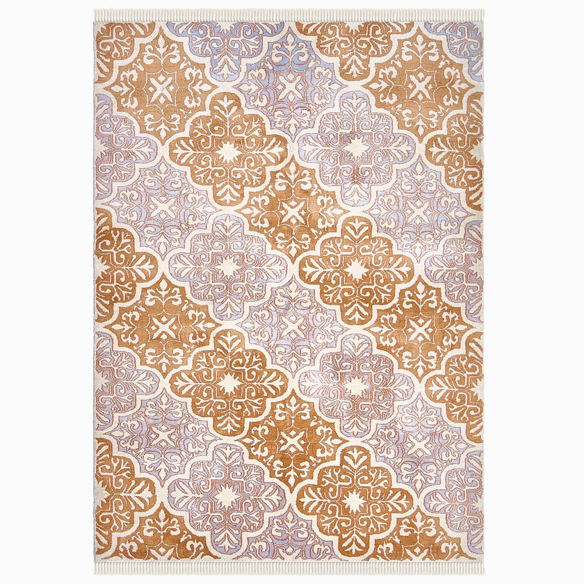 rug in lavender wool with floral/tile quatrefoil motif, demonstrating handwoven rug craftsmanship.