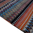 rug in blue wool with zigzag tribal stripe motif, demonstrating handwoven rug craftsmanship.