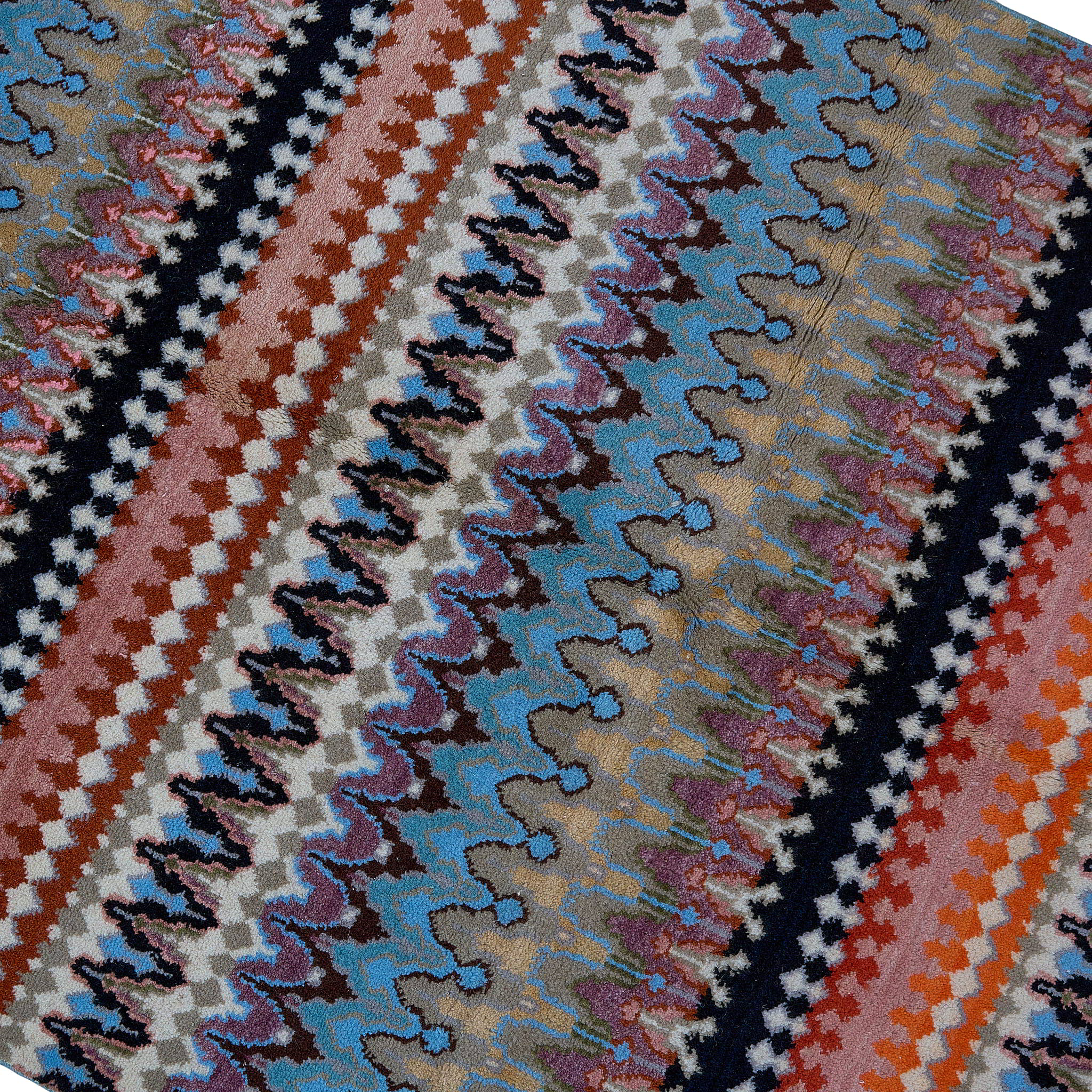 rug in blue wool with zigzag tribal stripe motif, demonstrating handwoven rug craftsmanship.