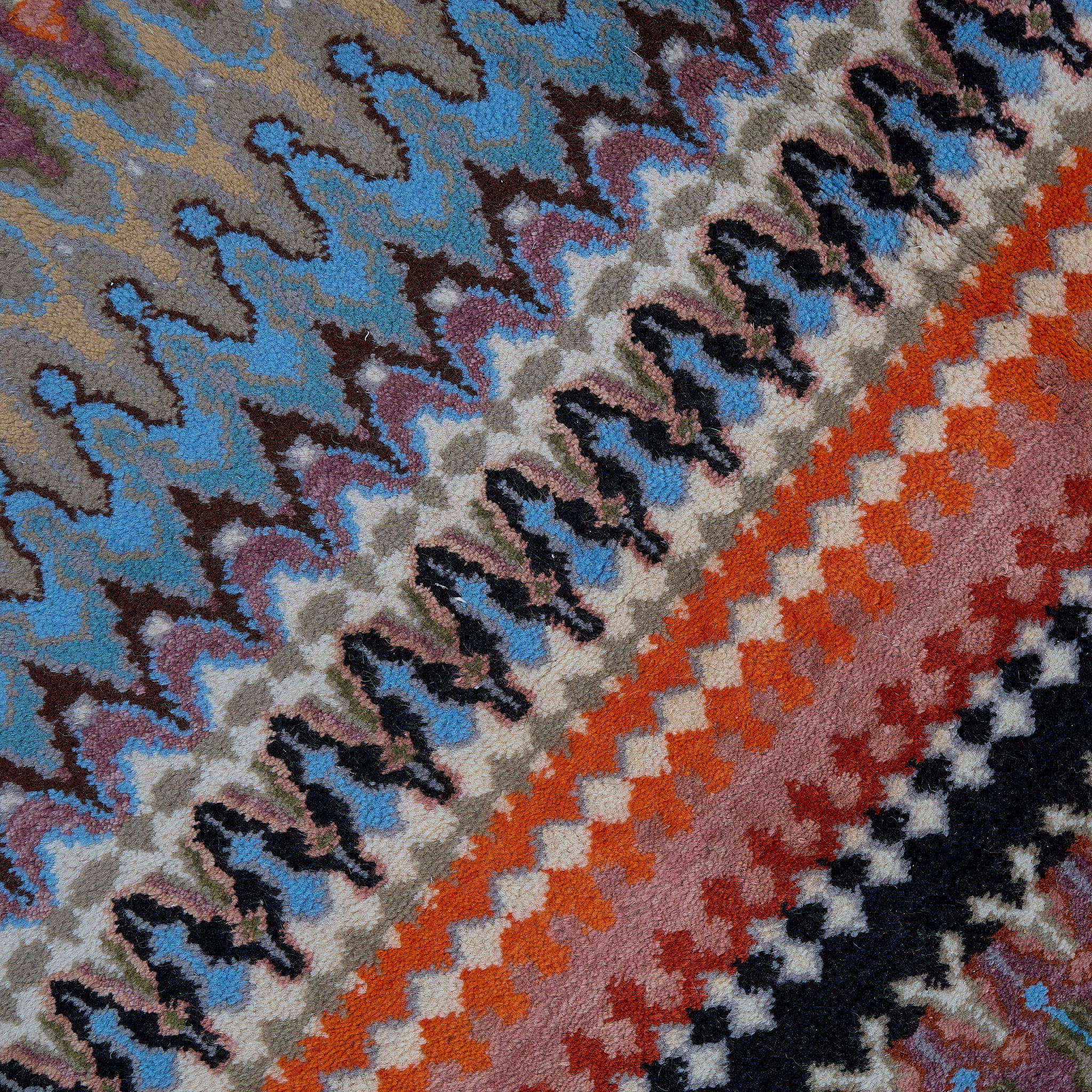 rug in blue wool with zigzag tribal stripe motif, demonstrating handwoven rug craftsmanship.