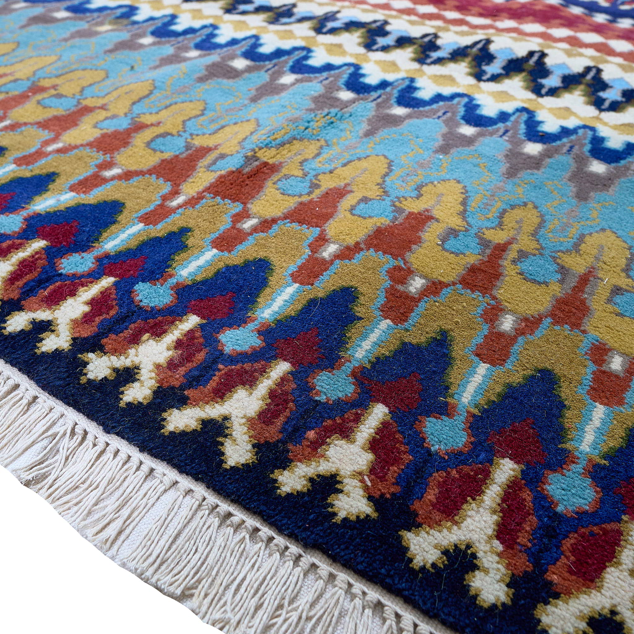 rug in navy wool with tribal striped wave motif, demonstrating handwoven rug craftsmanship.