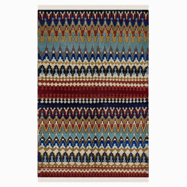 rug in navy wool with tribal striped wave motif, demonstrating handwoven rug craftsmanship.