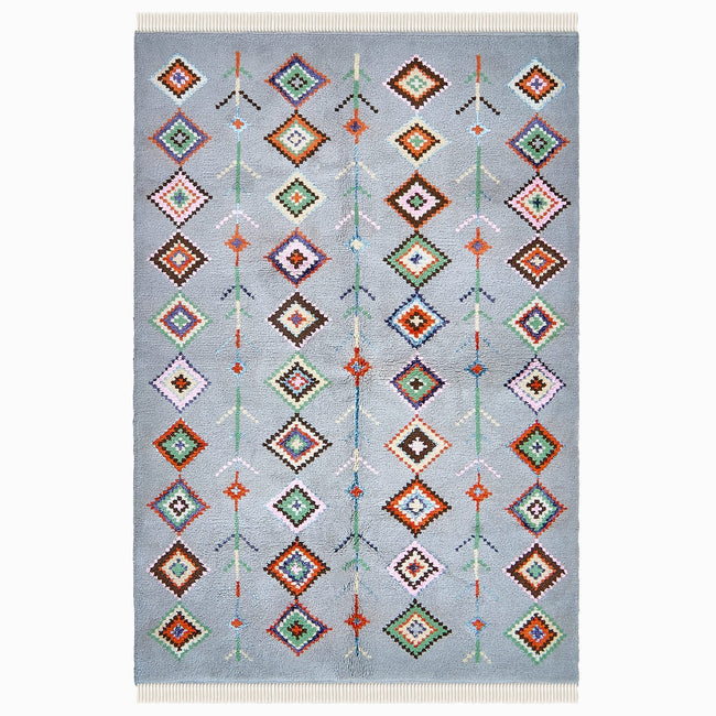 rug in soft grey wool with mixed tribal diamond/stripe motif, demonstrating handwoven rug craftsmanship.