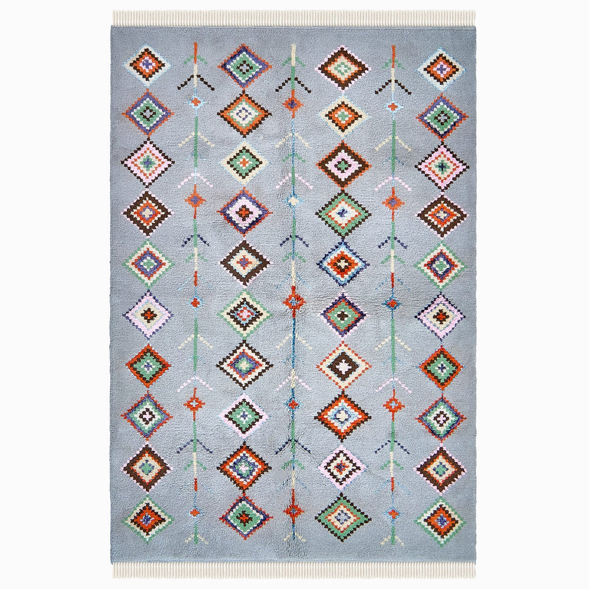 rug in soft grey wool with mixed tribal diamond/stripe motif, demonstrating handwoven rug craftsmanship.