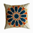 Cushion in petroleum and burnt orange polycotton with Najmi star geometry, demonstrating Khayamiya craftsmanship.