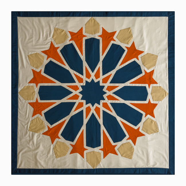 Square runner in petroleum and burnt orange polycotton with Najmi star geometry, demonstrating Khayamiya craftsmanship.