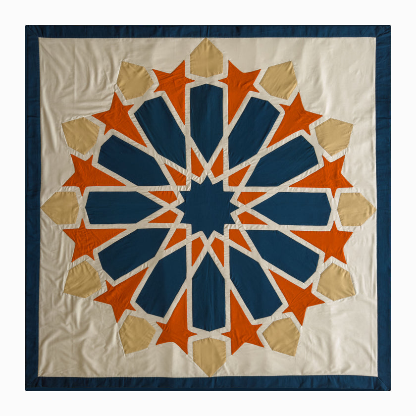 Square runner in petroleum and burnt orange polycotton with Najmi star geometry, demonstrating Khayamiya craftsmanship.