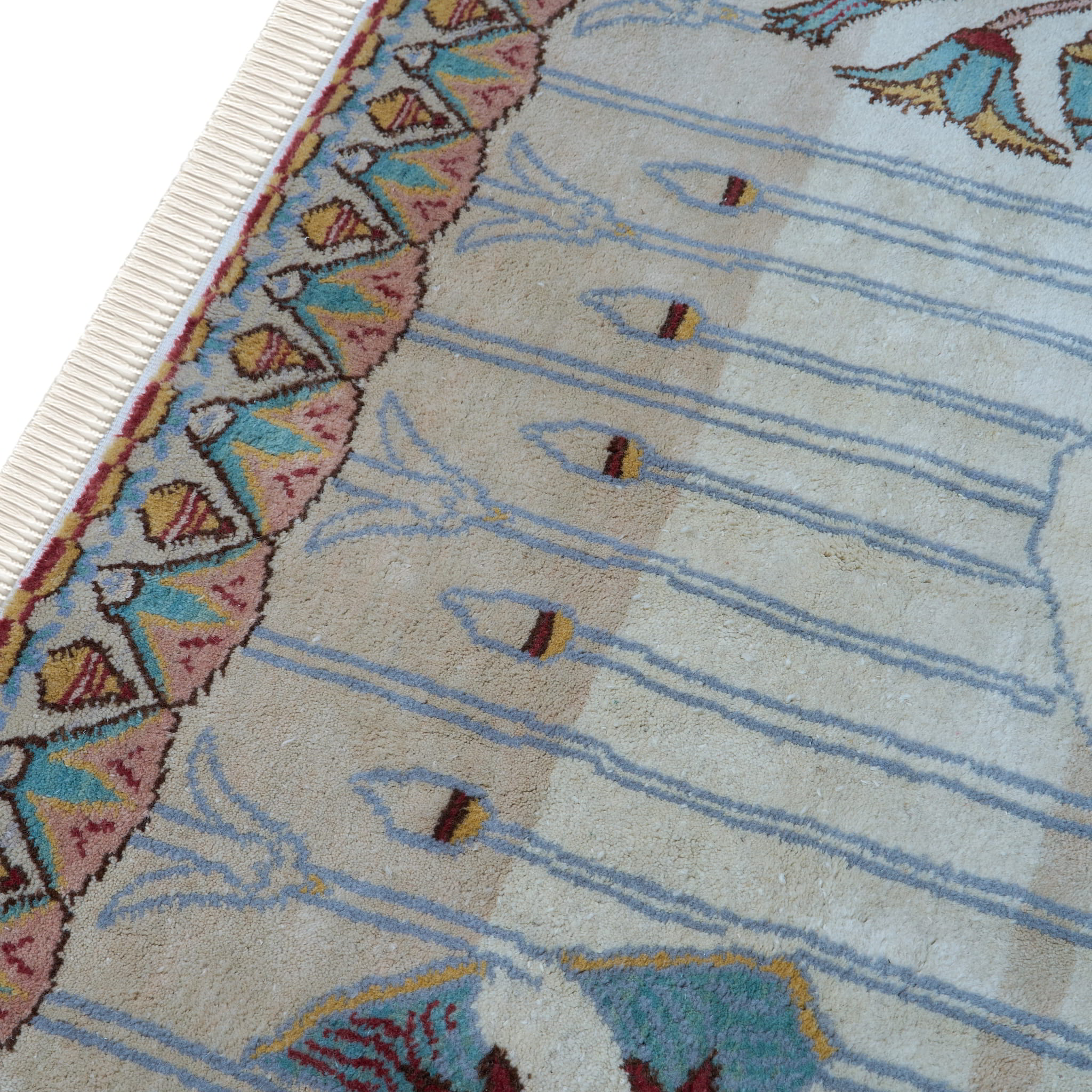 rug in brown wool with transitional floral motif, demonstrating handwoven rug craftsmanship.