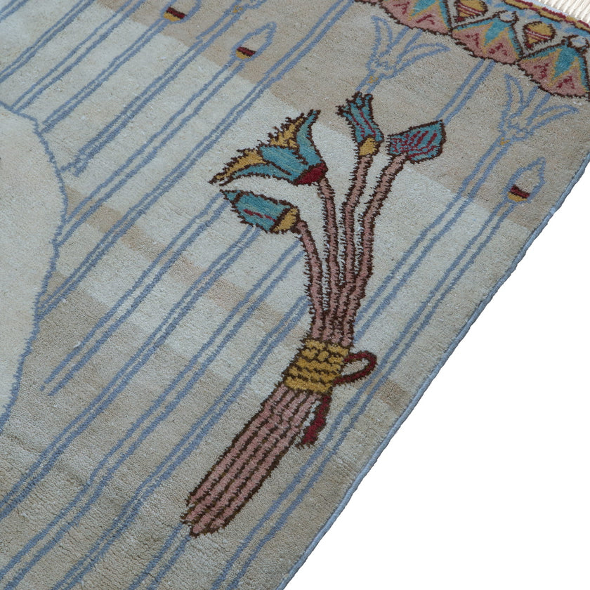 rug in brown wool with transitional floral motif, demonstrating handwoven rug craftsmanship.