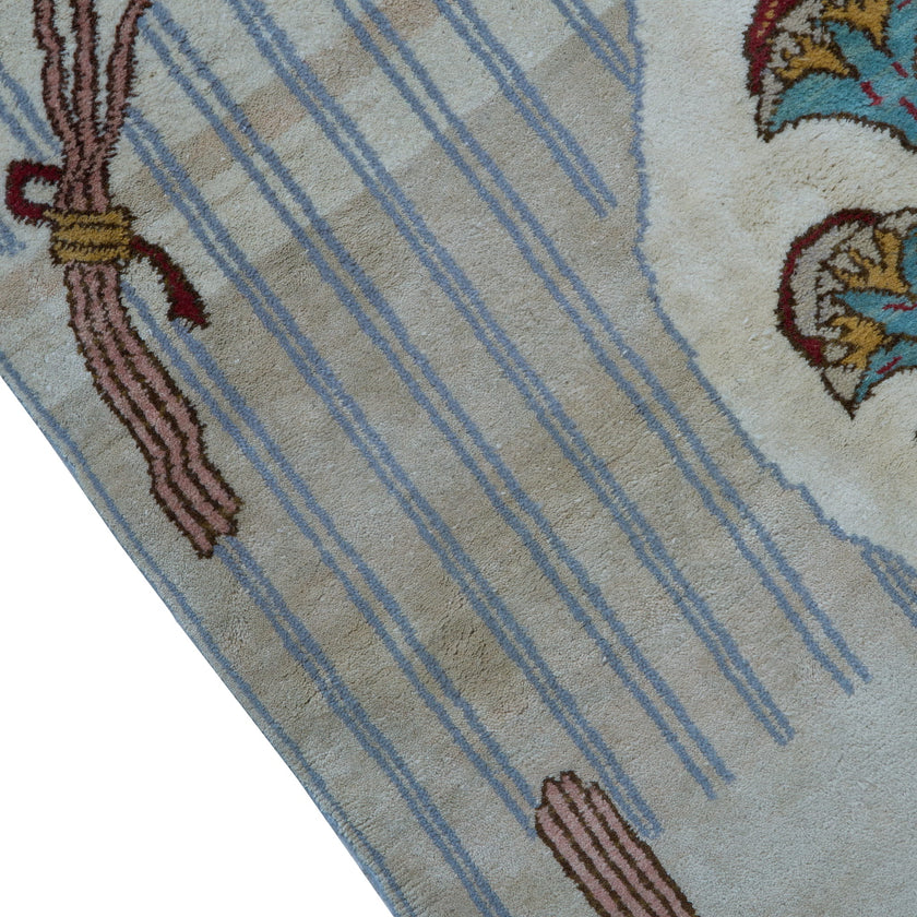 rug in brown wool with transitional floral motif, demonstrating handwoven rug craftsmanship.